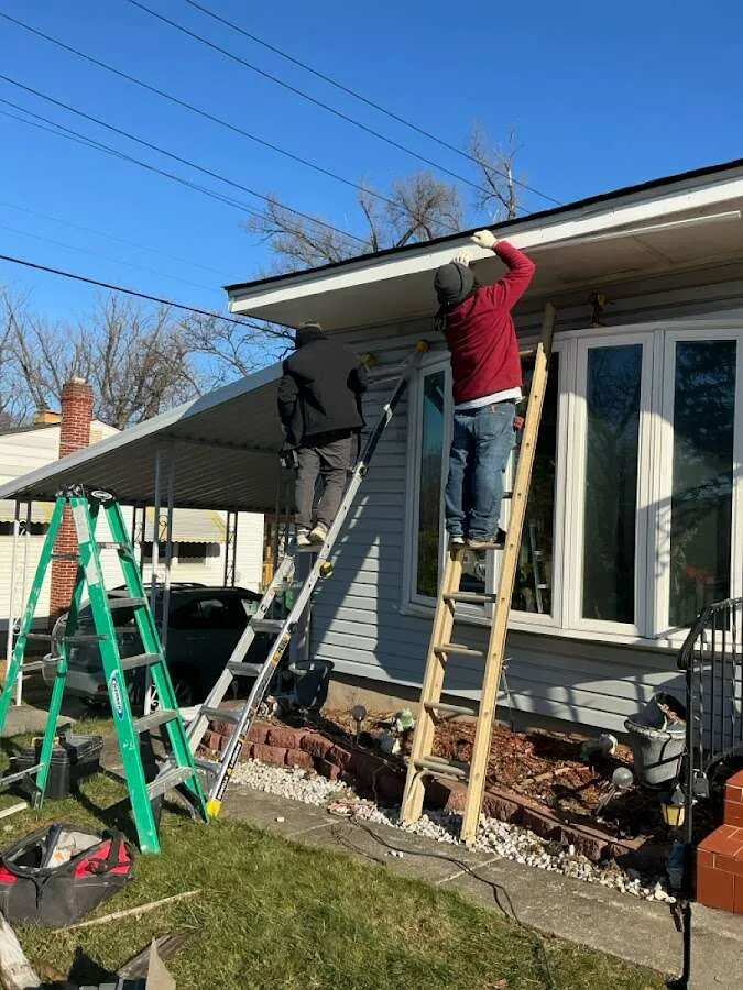Restoration crew performing exterior repair in Upton